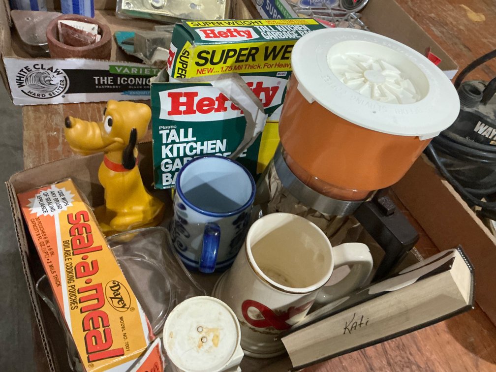 Vintage Coffee Pot, Partial Box of 11-Gallon Trash Bags, Avon Plastic Pluto Bottle (Empty), Glass Ashtray, Kitchen Diet Scale, Lucky Fine Beer Mug and More