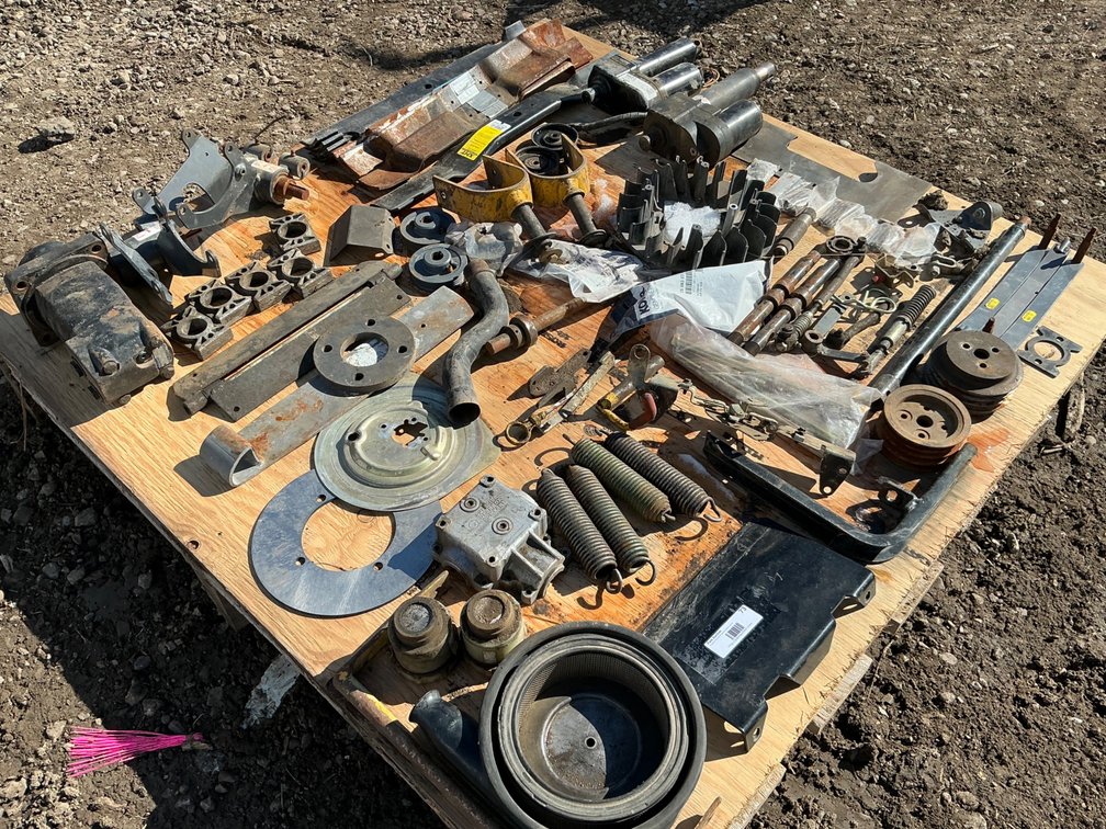 Pallet of Walker Mower Parts - Assorted Blades, Springs, Yokes, Acuators, Pulleys, Nuts, Bolts and More