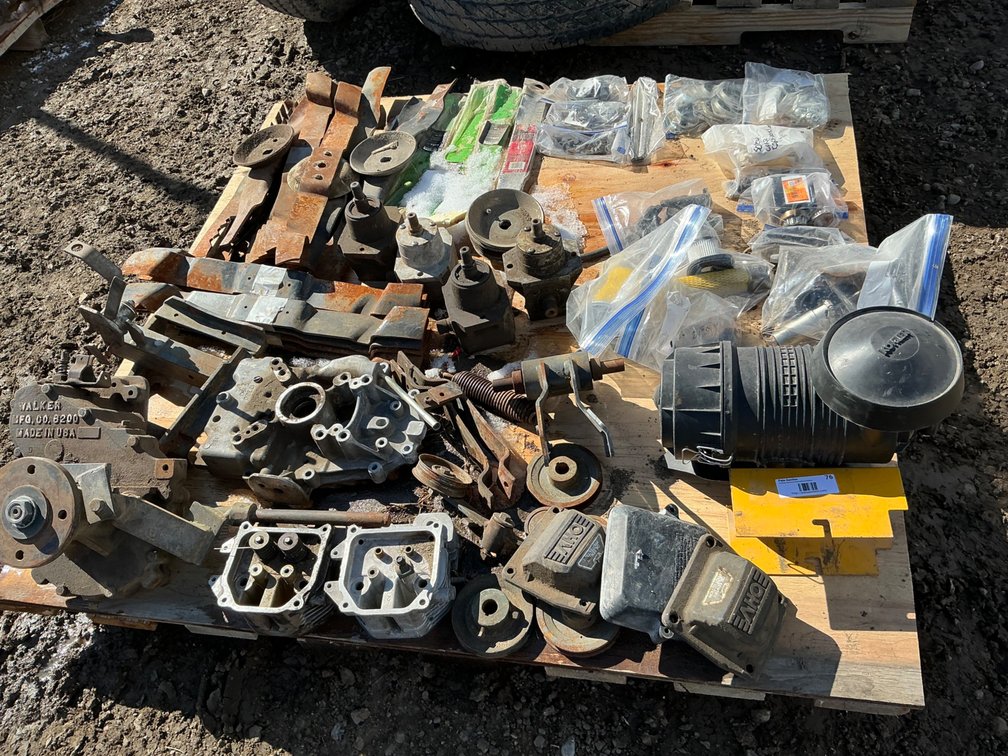 Pallet of Walker Mower Parts - Assorted Blades, Oil Sentry Covers, Some Air Filters, Nuts, Bolts, Air Filter Housing, Gear Box Parts and Other Miscellaneous Parts