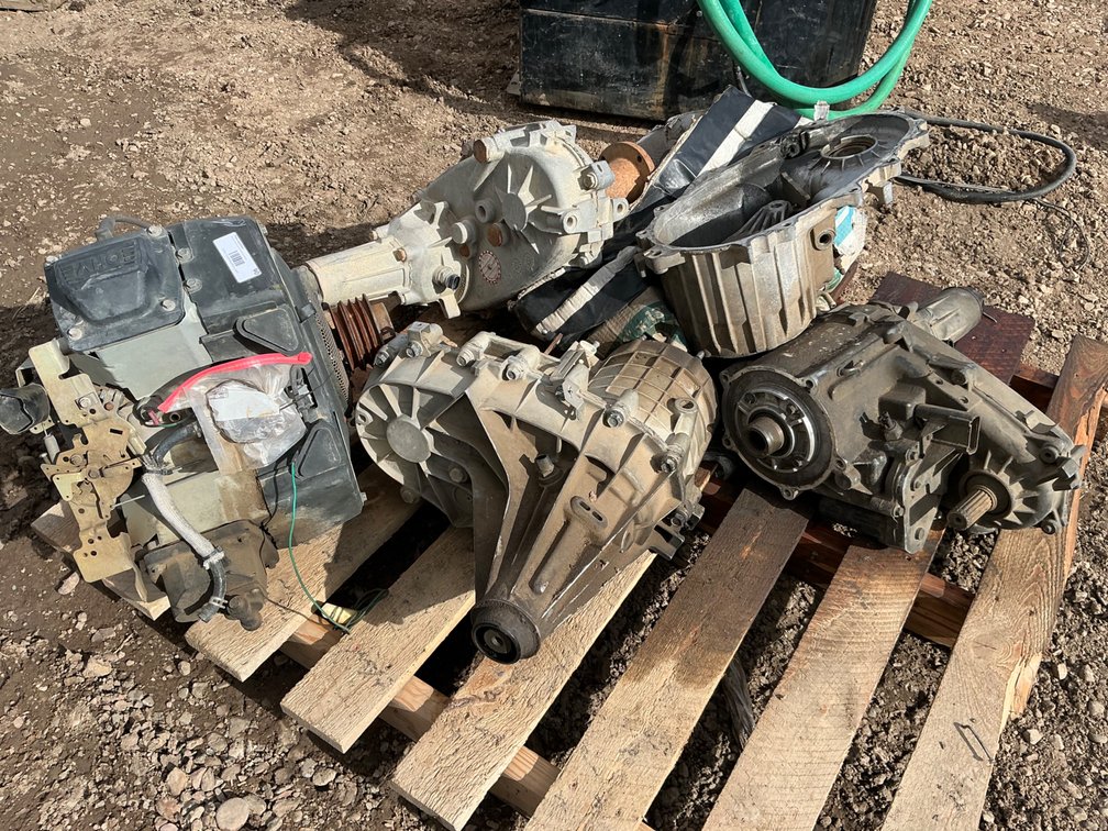 (3) Transfer Cases, (1) Parts Transfer Case and (1) V Twin Parts Engine