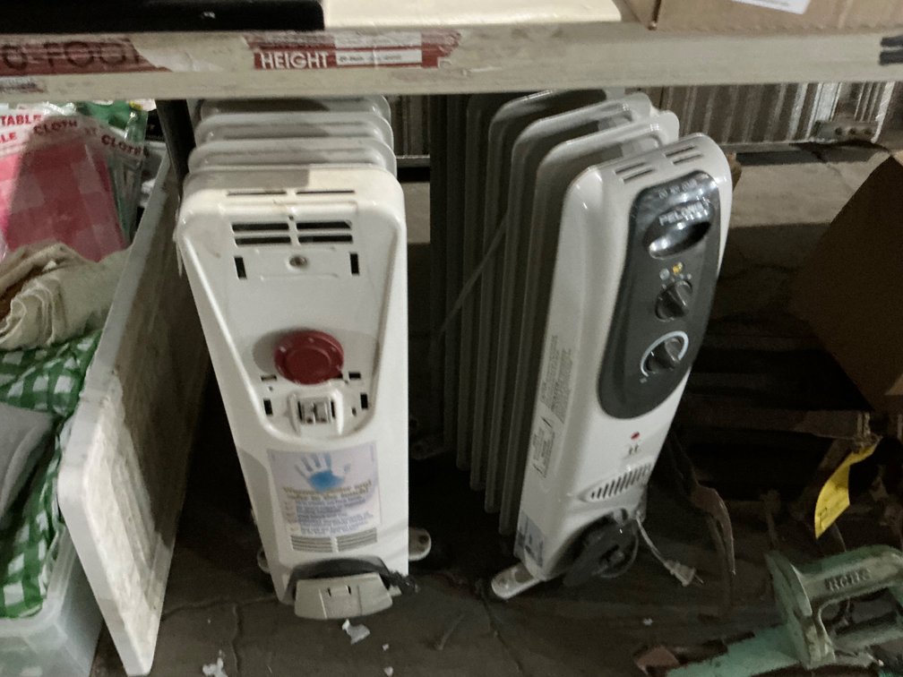 (2) Rolling Oil Filled Radiator Electric Space Heaters (One is Missing Panel On Front Display)