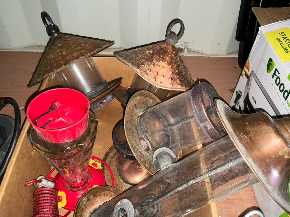 Box Of Assorted Bird Feeders, Hummingbird Feeders, Dog Tie Out Stakes And Tie Out Cable