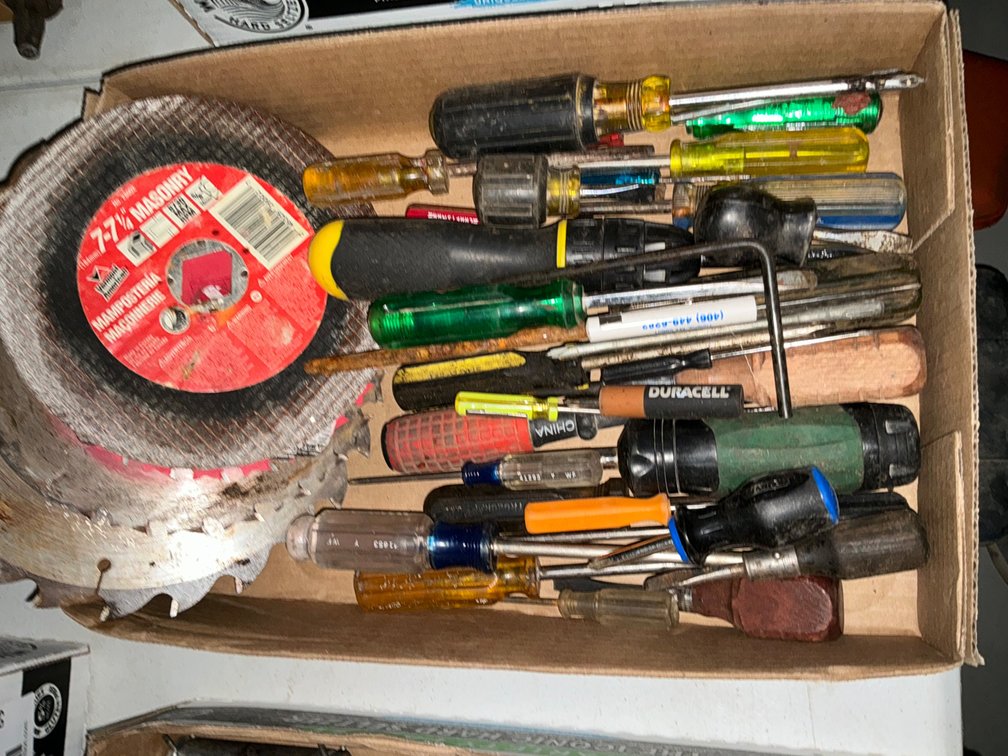 Box Of Assorted Screwdrivers And Saw Blades