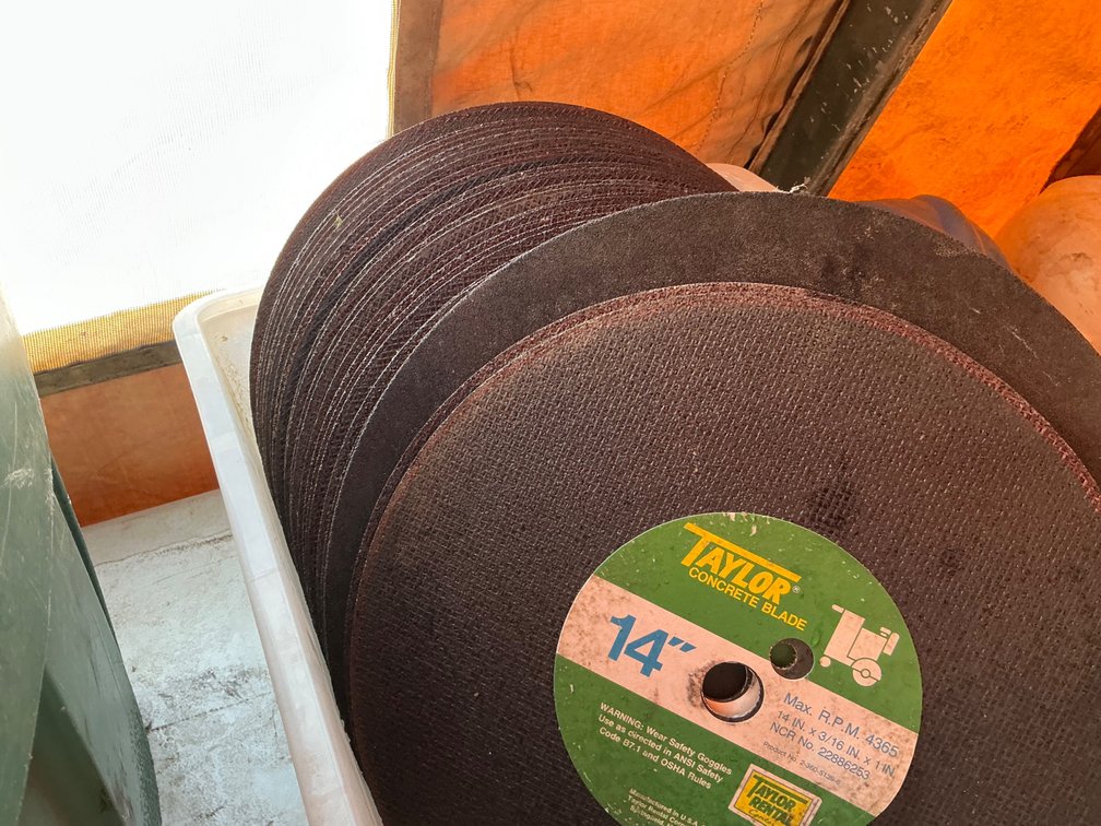 Approximately (26) 14" Cut-Off Wheels - Most Are Taylor Concrete Blade Brand, A Few Worn Down Squar'n Forged Big Wheel Cut-Off Wheels, And (1) Makita 16" Cut-Off Wheel