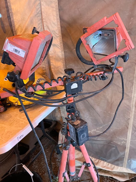 Regent Lighting WZT1000 (2) Lamp Corded Tripod Work Light With Additional Built-In Outlet (One Lamp Head Is Missing Cover & Frame Is Askew)