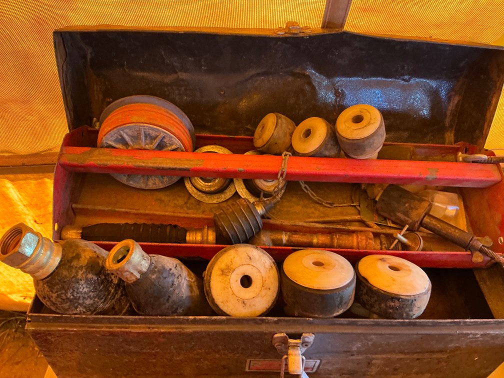 Metal Toolbox Containing Assorted Sewer Plugs And Test Plugs