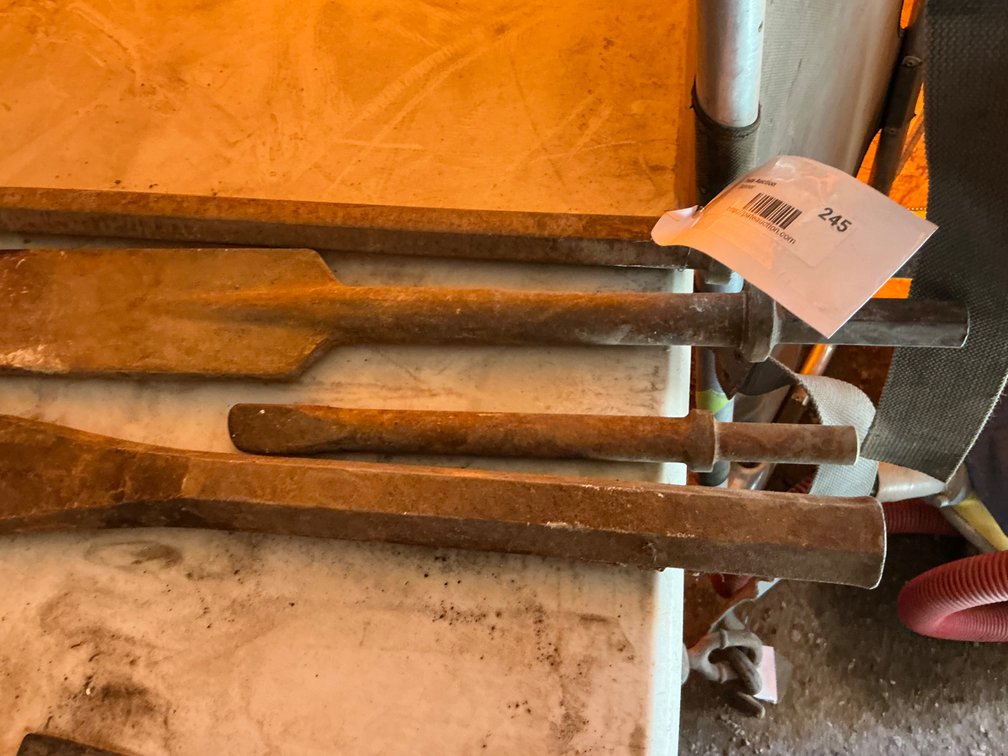 (1) Heavy Duty Cold Chisel/Masonry Chisel - 20"L, (1) Moil Point Chisel Jack Hammer Bit With Hex Head - 18", (1) Flat Chisel Bit With Hex Head - 18", And (1) Small Flat Chisel Bit With Round Head - 9"