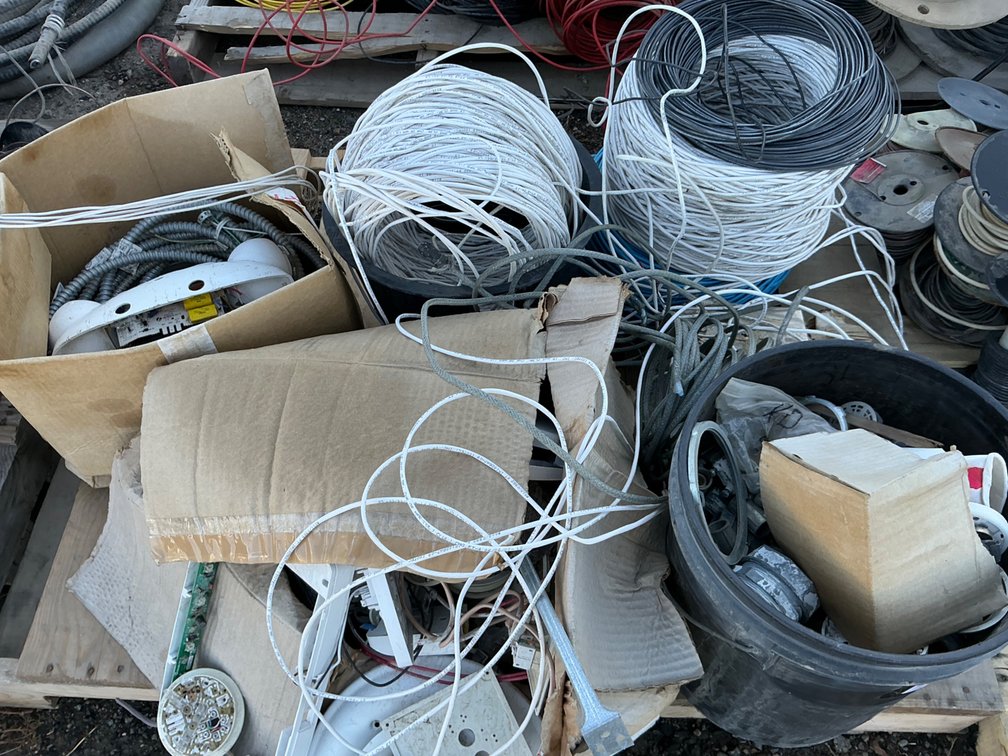 Pallet Containing - (4) Partial Rolls of Assorted Electrical Wiring, Electrical Flex Conduit, Thermostat Gauges, And Bucket Of Electrical Conduit Fittings
