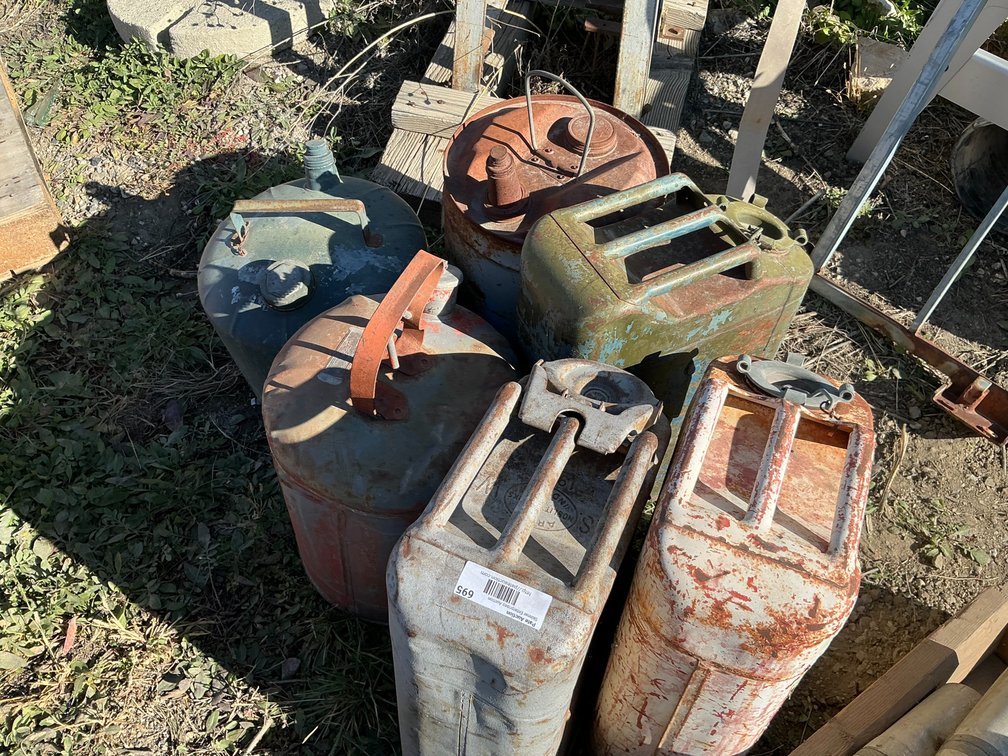 (3) Jerry Cans, (1) Eagle 4-Gallon Metal Gas Can, (1) Vintage Metal Gas Can, And (1) Metal Mobil Oil Can