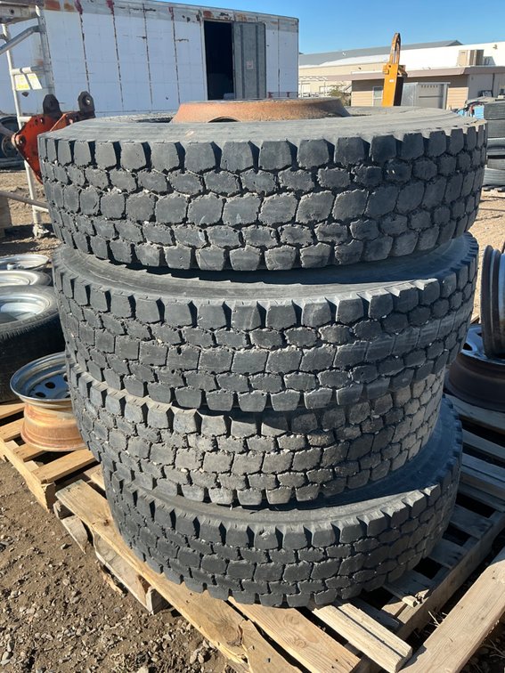 (4) 11R22.5 Tires On 10-Lug Steel Wheels - Fair Tread