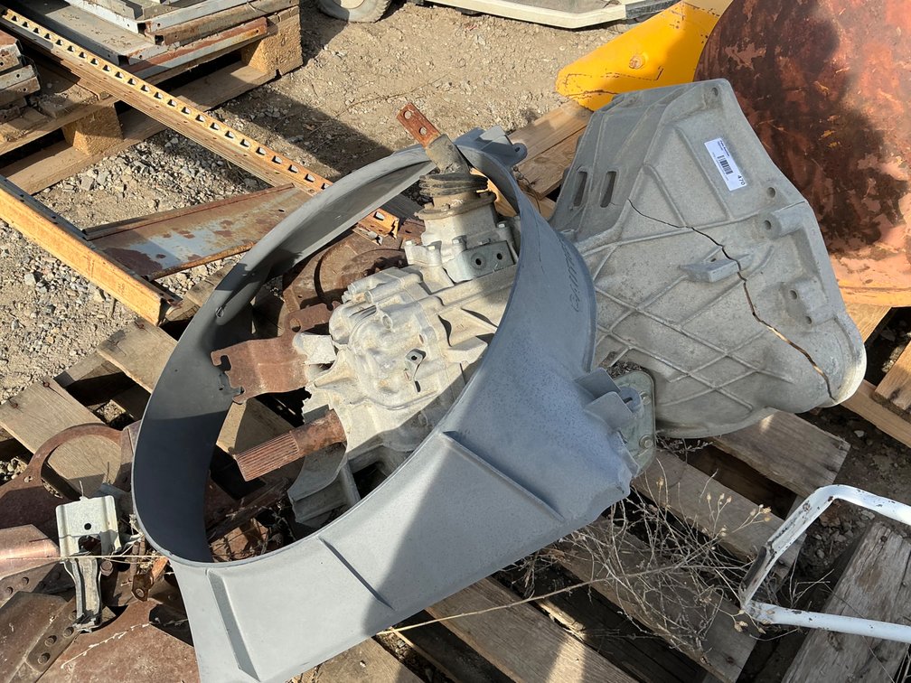 (1) Ford Transmission - Model: 5-42 (Bell Housing Cracked - Parts Only), And (1) Ford Plastic Engine Fan Shroud
