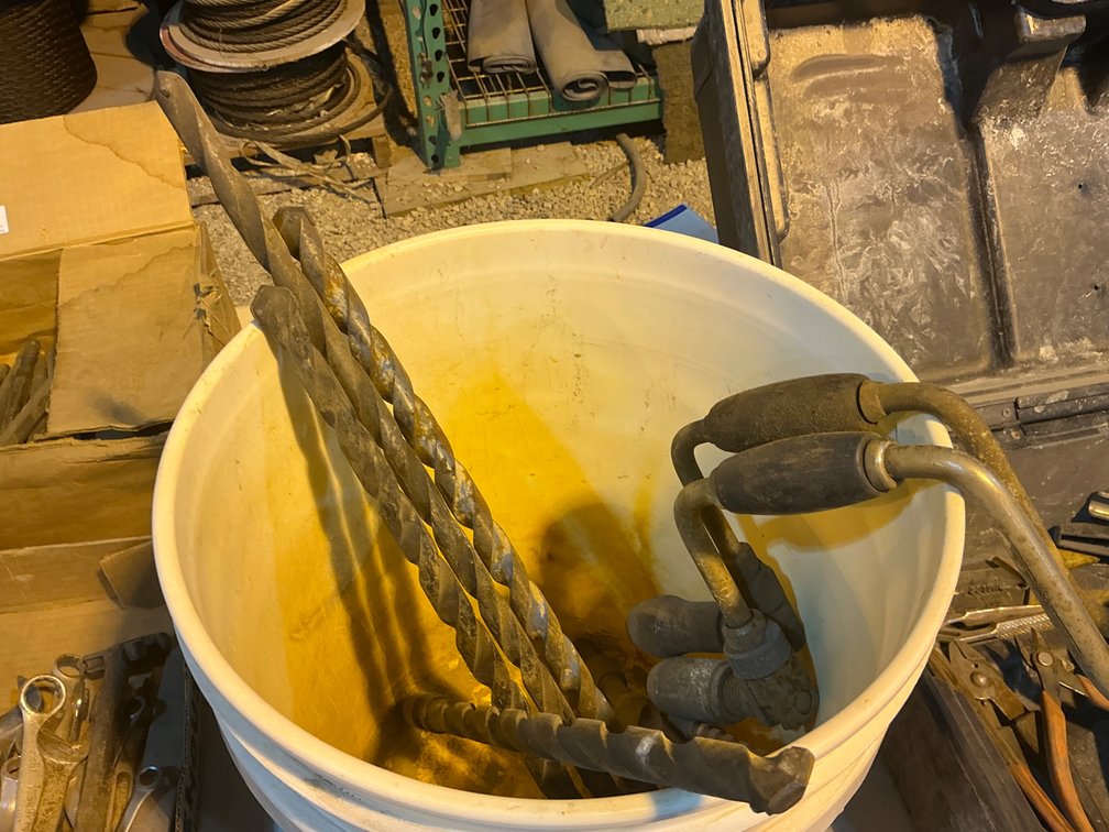 Bucket Containing (2) Drilling Braces And (7) Assorted Bits