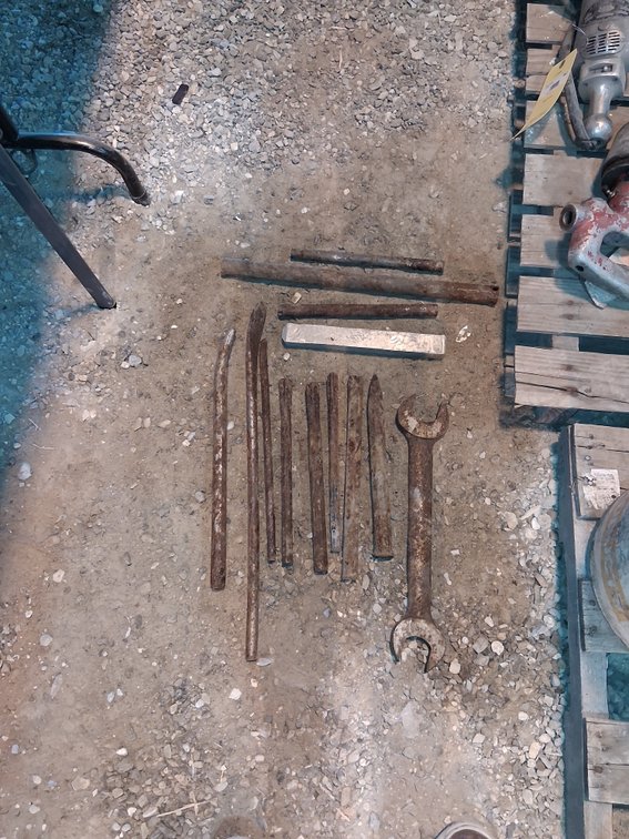 (1) Large Wrench - 1-1/2" & 5/8", (3) Custom Pry Bars, (5) Assorted Chisels, And (4) Assorted Metal Bars