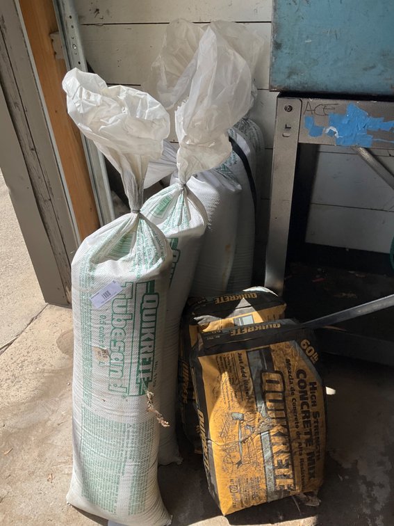 (5) Bags of .5 Cubic Feet Tube Sand and (2) 60Lb. Bags of Quikrete
