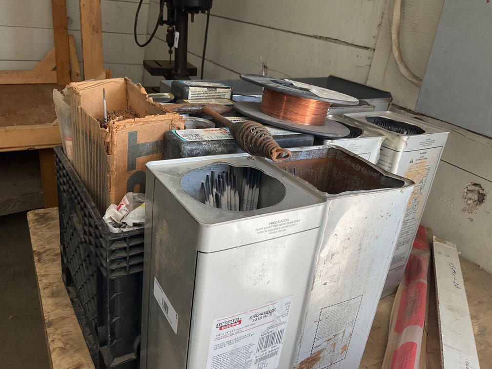 Approximately (17) Partial Containers of Assorted Welding Rod - 7018, 6011, 6010 etc., Partial Roll of Mig Wire and (4) Assorted Tig Welding Rods