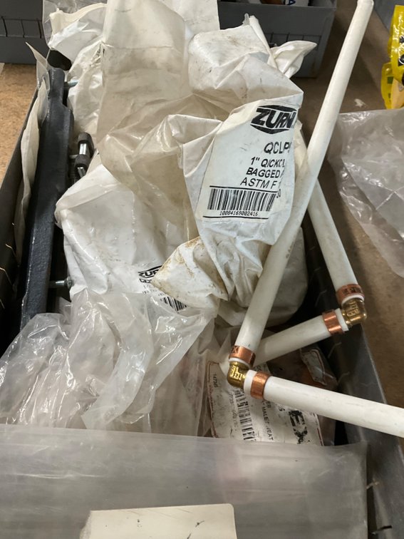 Metal Bin Full of Assorted Pex Fittings, 1/2" Drop Ear 90's, 1" Pex x 1" Sweat Adaptors, 1"x3/4"x1/2" Tee Pex, Etc.