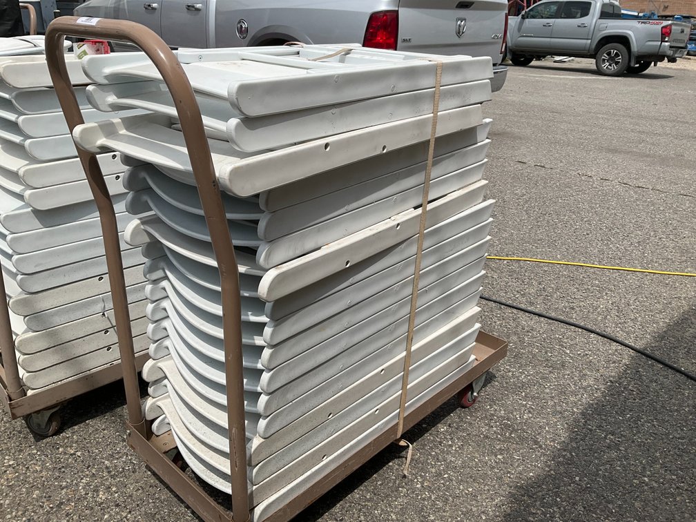 Rolling Cart with Approximately (17) White Plastic Padded Folding Chairs
