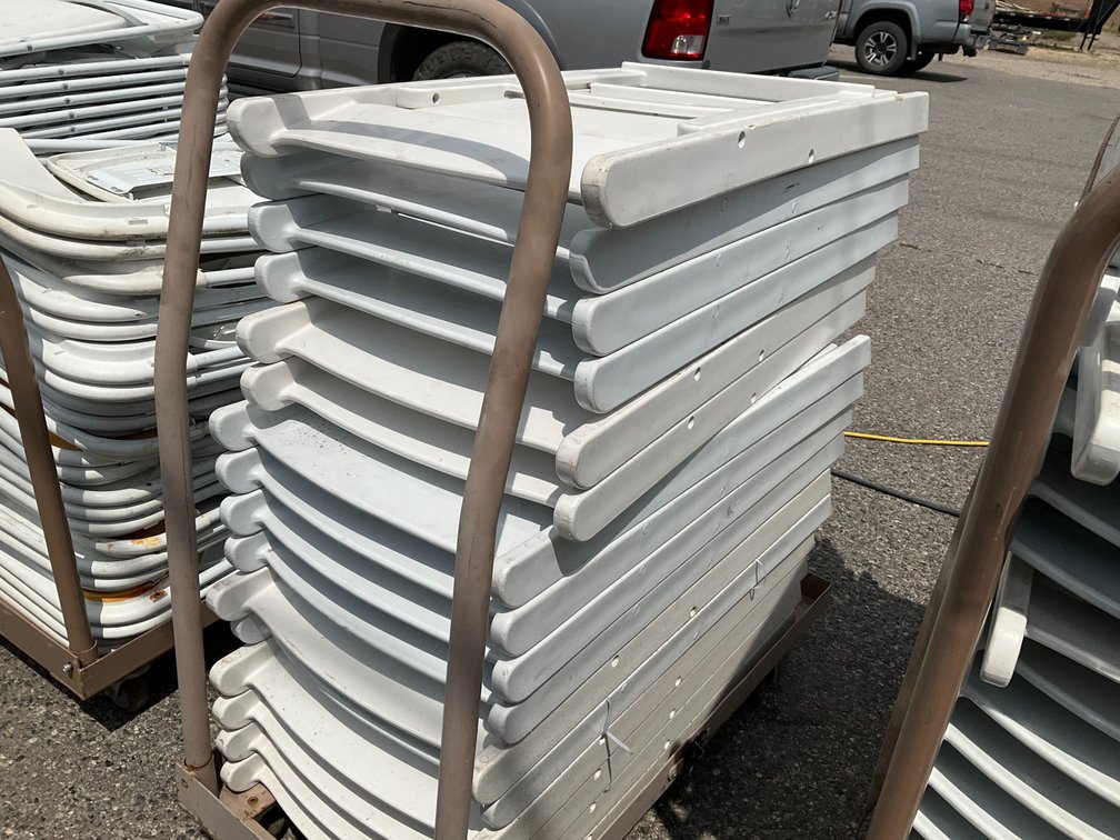 Rolling Cart with Approximately (16) White Plastic Padded Folding Chairs