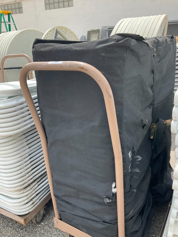 Rolling Cart with Approximately (42) Metal Frame White Plastic Folding Chairs