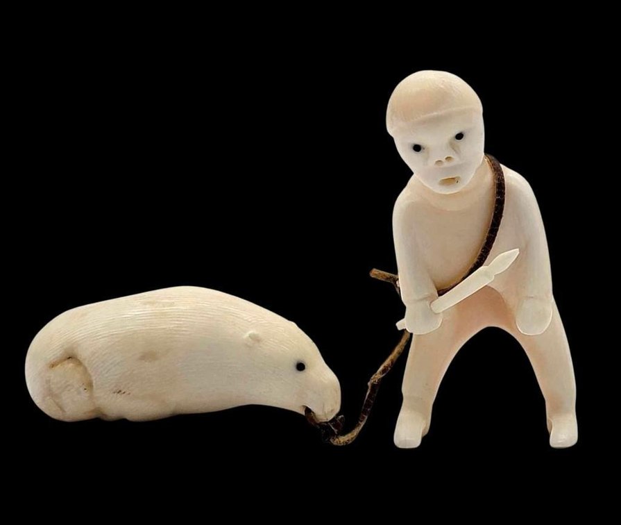 Greenlandic Inuit Carving of Hunter Dragging His Harvest