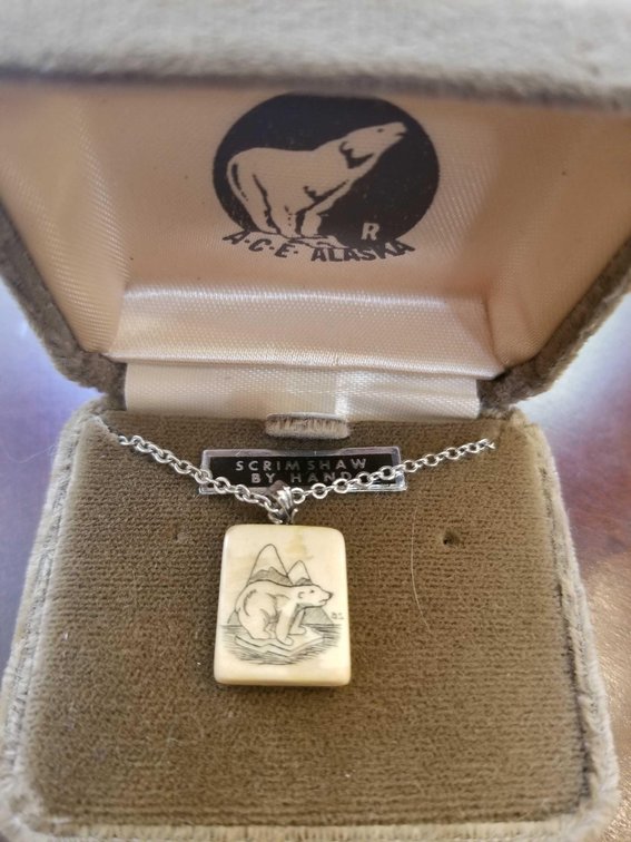 Ivory scrimshawed pendant
