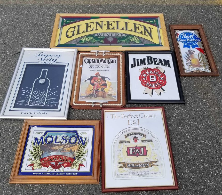 Huge collection of old alcohol advertising mirrors and displays