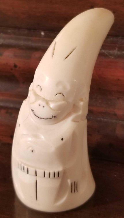 Carved whales tooth Billiken