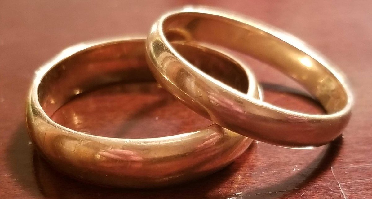 Two solid gold wedding bands 