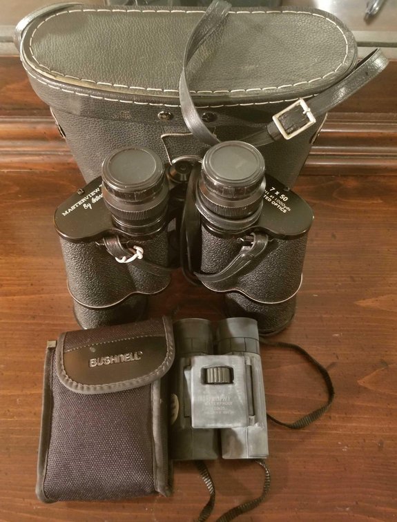 Two pairs of cased binoculars 