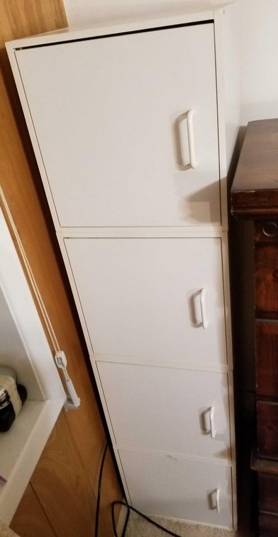 Four tiered upright storage locker 