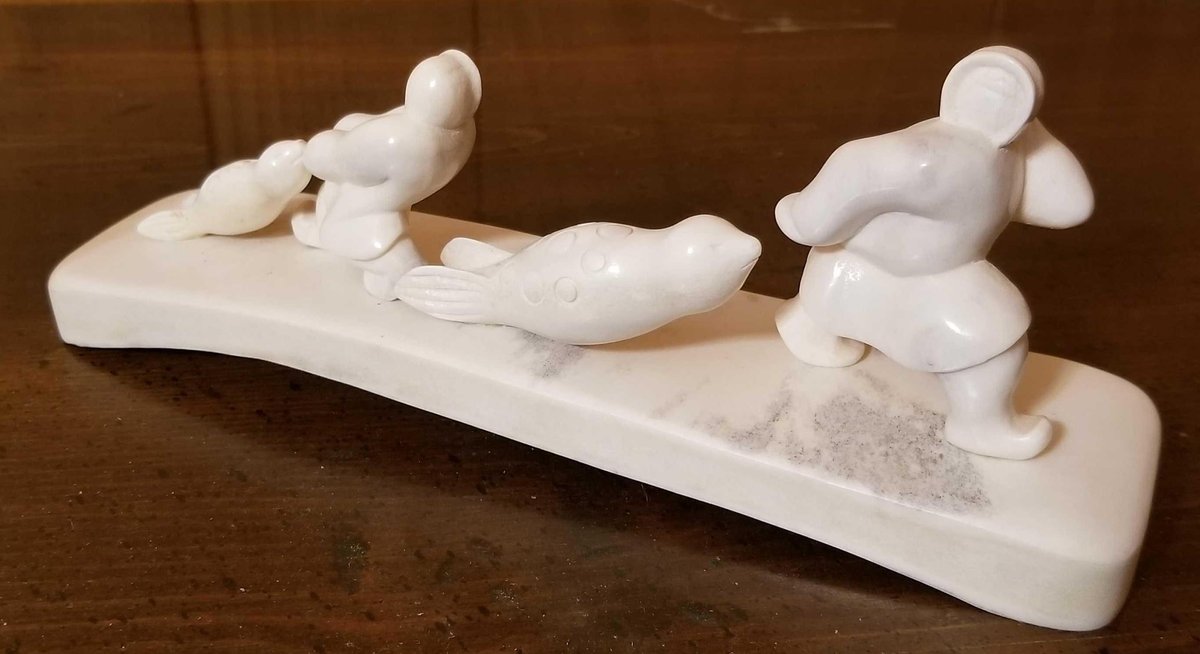 Large polished bone Russian carving of seal hunters 