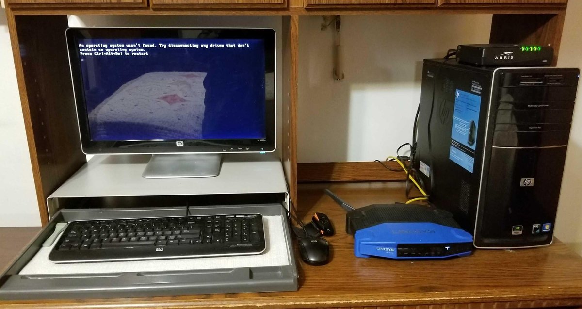 HP Computer, monitor, Linksys router, keyboard and mouse