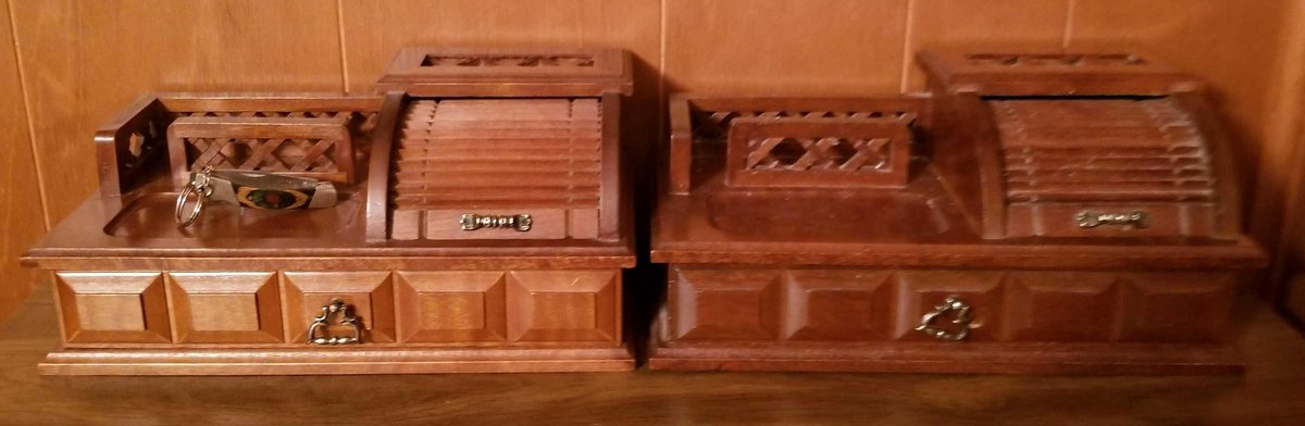 Two miniature roll top storage containers and contents 