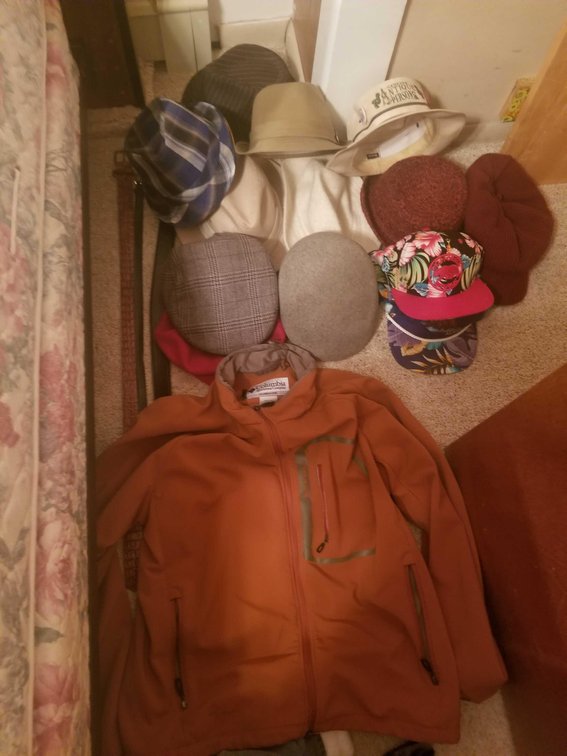 Assorted hats, belts, and a Columbia Titanium jacket 