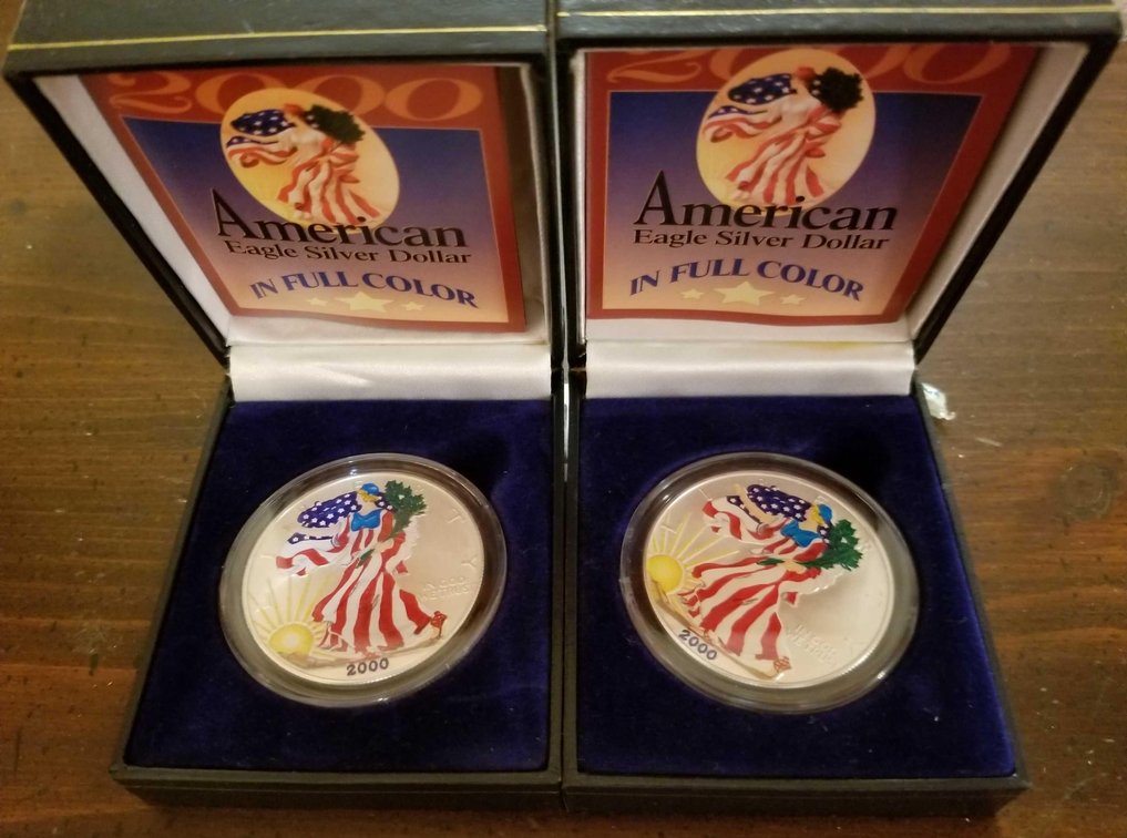 Two one ounce 2000 American Silver Eagle colorized coins 