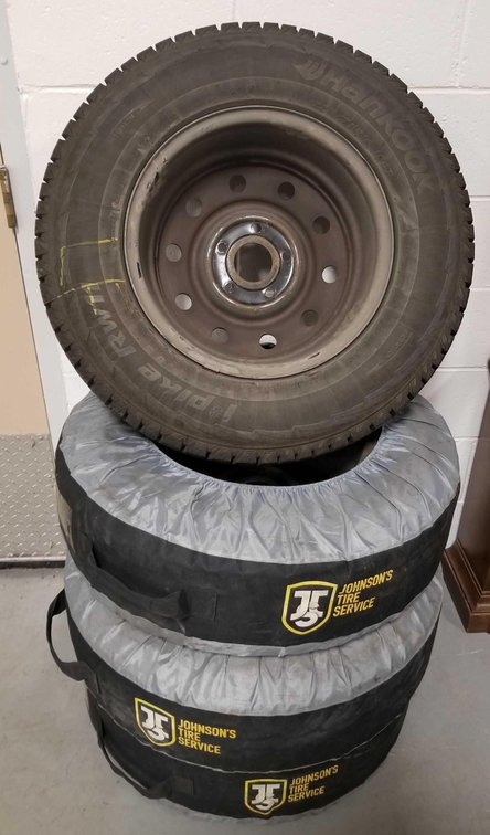 Lot of four like new Hankook 225/75R16 104T studded tires