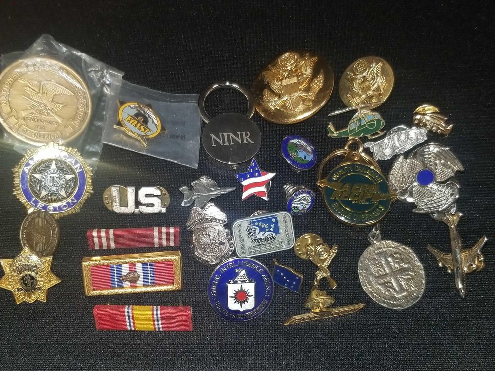 Lot or assorted collectors pins, military items etc.