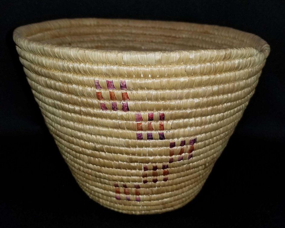 Woven Eskimo grass basket with dyed seal gut inlays 