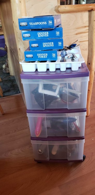 Unsorted plastic drawers of Kitchenware