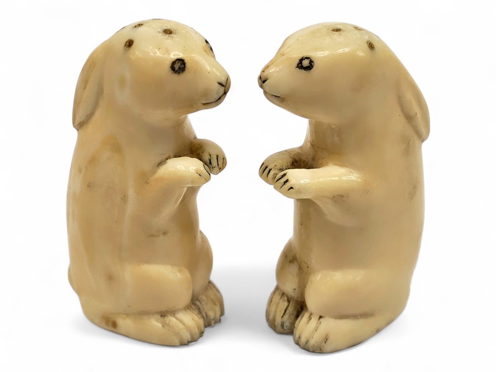 Pair of Early Mineralized Walrus Tusk Hare Shakers, Possibly Happy Jack