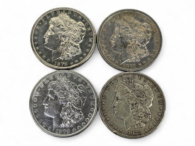 1878-S, 1879 (3x) Morgan Silver Dollars