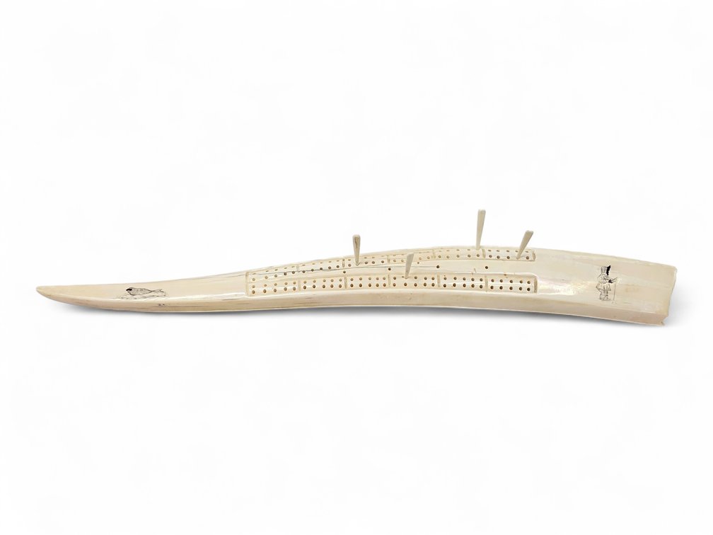 Walrus Tusk Cribbage Board with Four Pegs, Attributed to Arnie Iyakitan