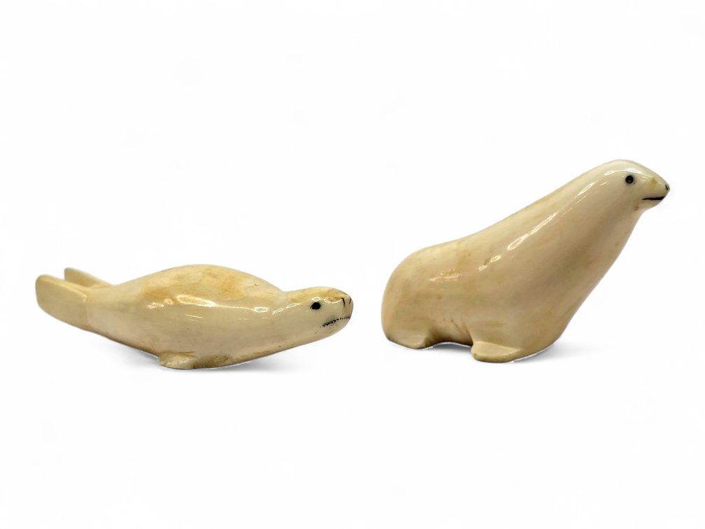 Two Miniature Walrus Ivory Seal Carvings