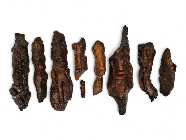 Nine Carved Wood & Bark Faces, Eight Signed Ricky Rismoen