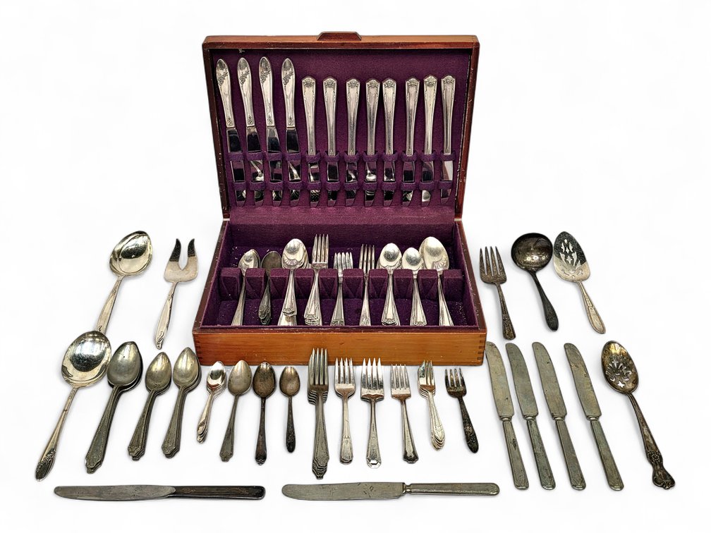 Mixed Silverplate Flatware & Serving Pieces in a Purple-Lined Wooden Chest