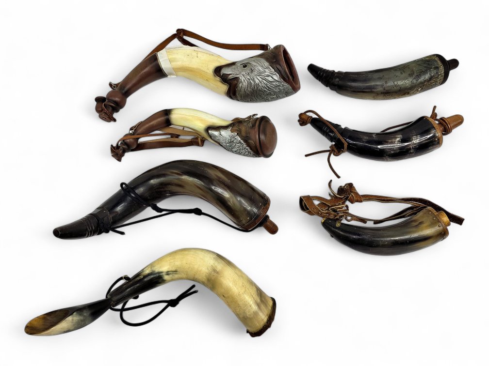 Seven Reproduction Powder Horns, Including Eagle & Wolf Motifs — One Damaged