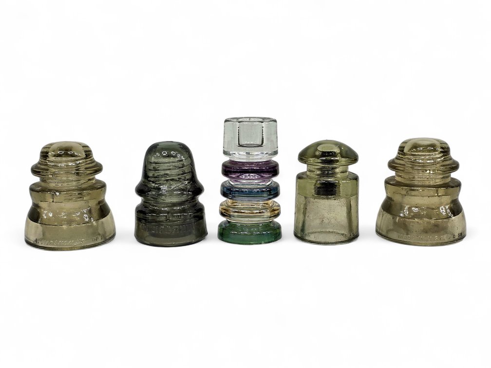 Four Glass Line Insulators, Armstrong & California, with Stacked Glass Candleholder