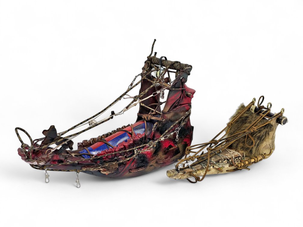 Two Animal-Jawbone Model Sleds with Leather, Cord & Fur Details