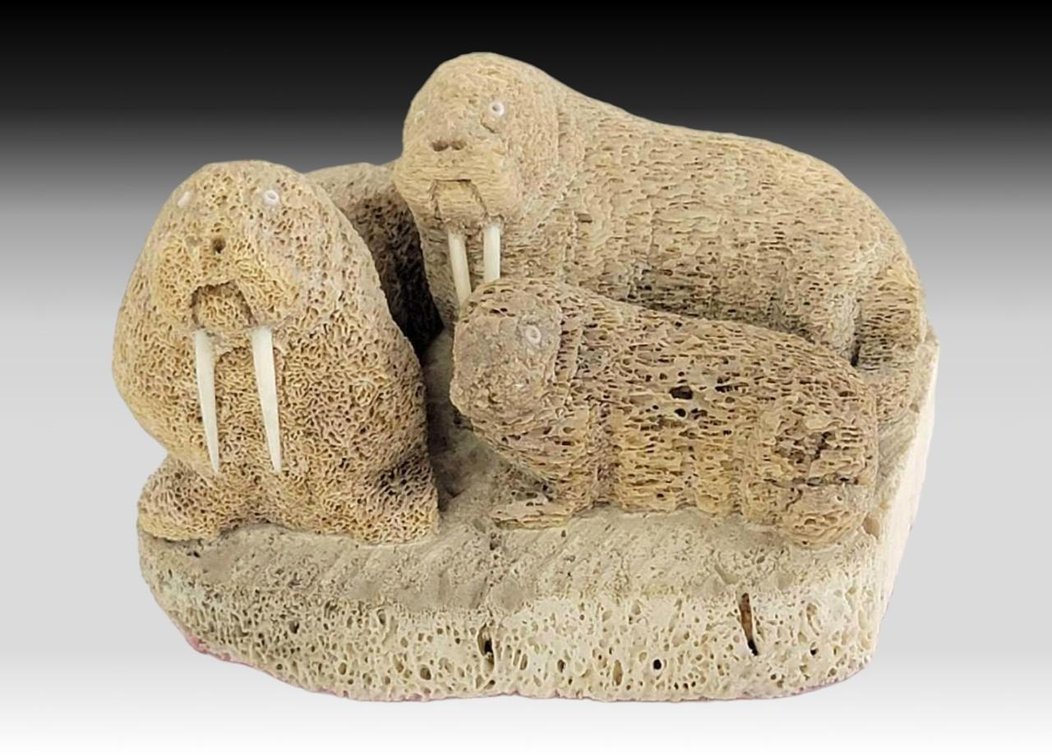 Nestling Whale Bone Walruses w/ Ivory Tusks