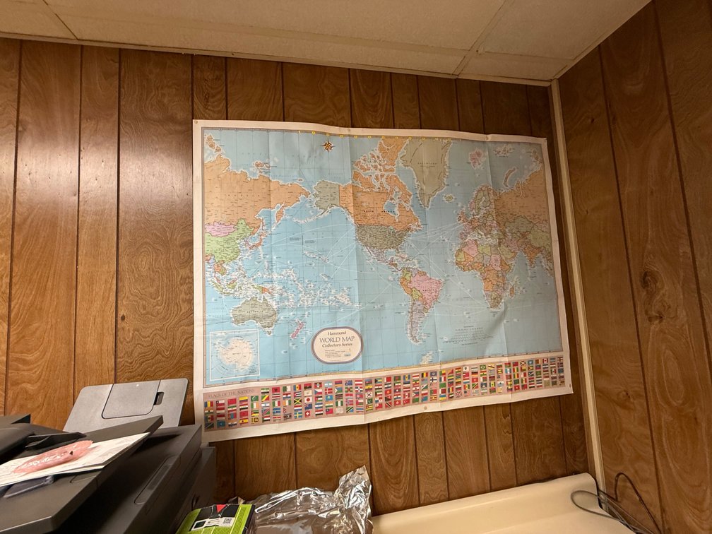 Vintage State & World Maps in Hallway